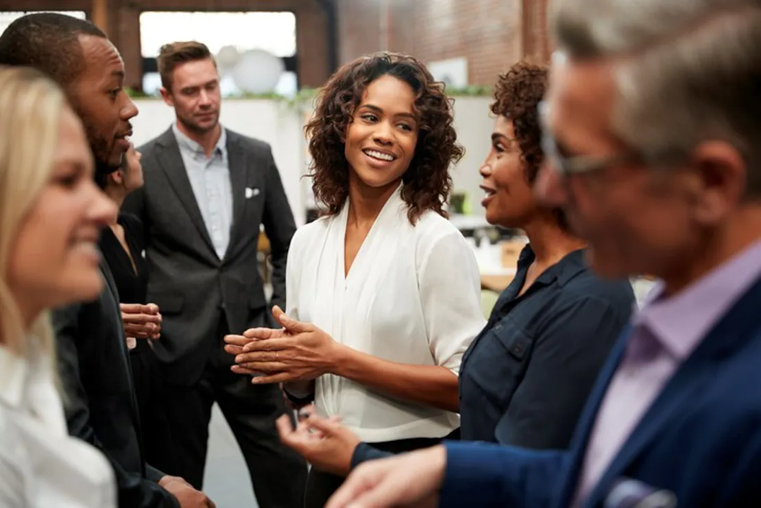 Business team standing having meeting about free cash flow