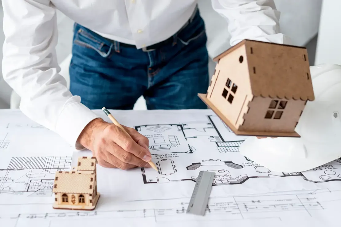 Architect Showing Miniature Projects building project