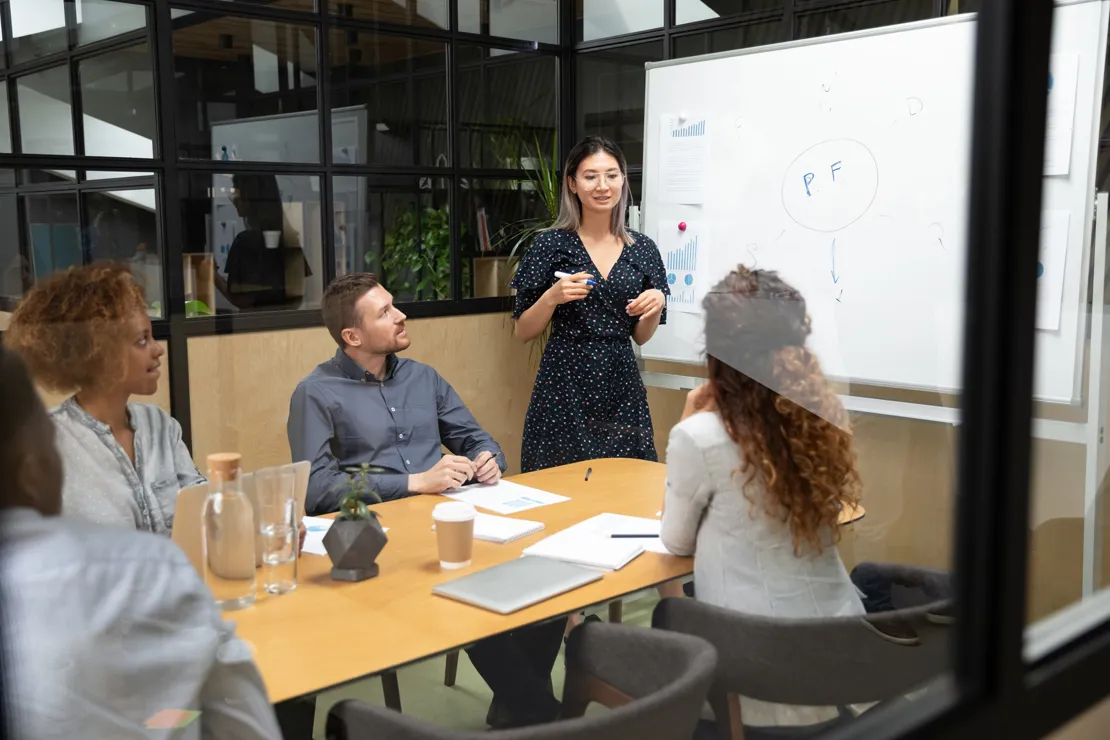 Group of men and woman in a meeting room