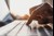 Man's finger clicking a laptop keyboard