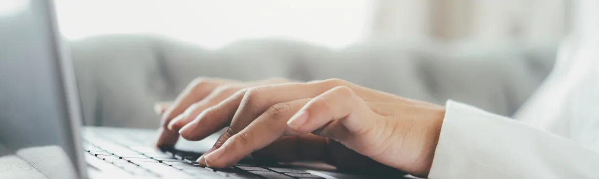Man typing on a laptop