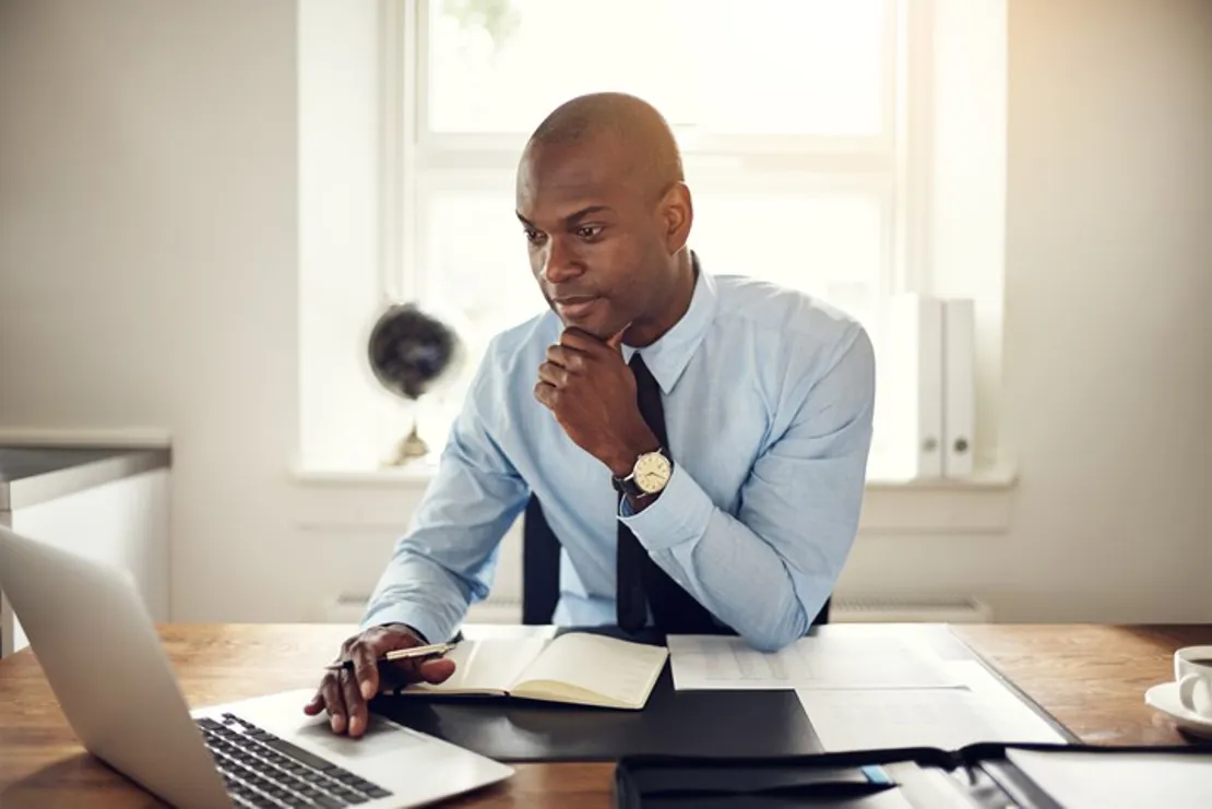 Young Businessman Working On A Laptop In Office