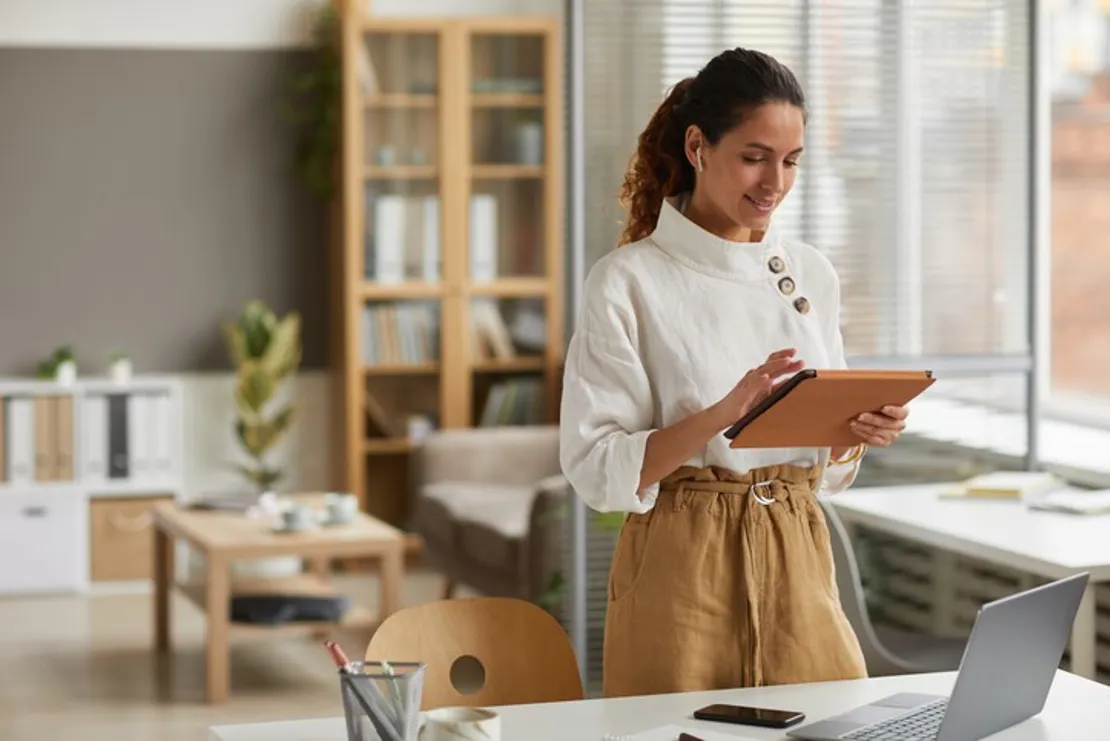 Woman using tablet in office