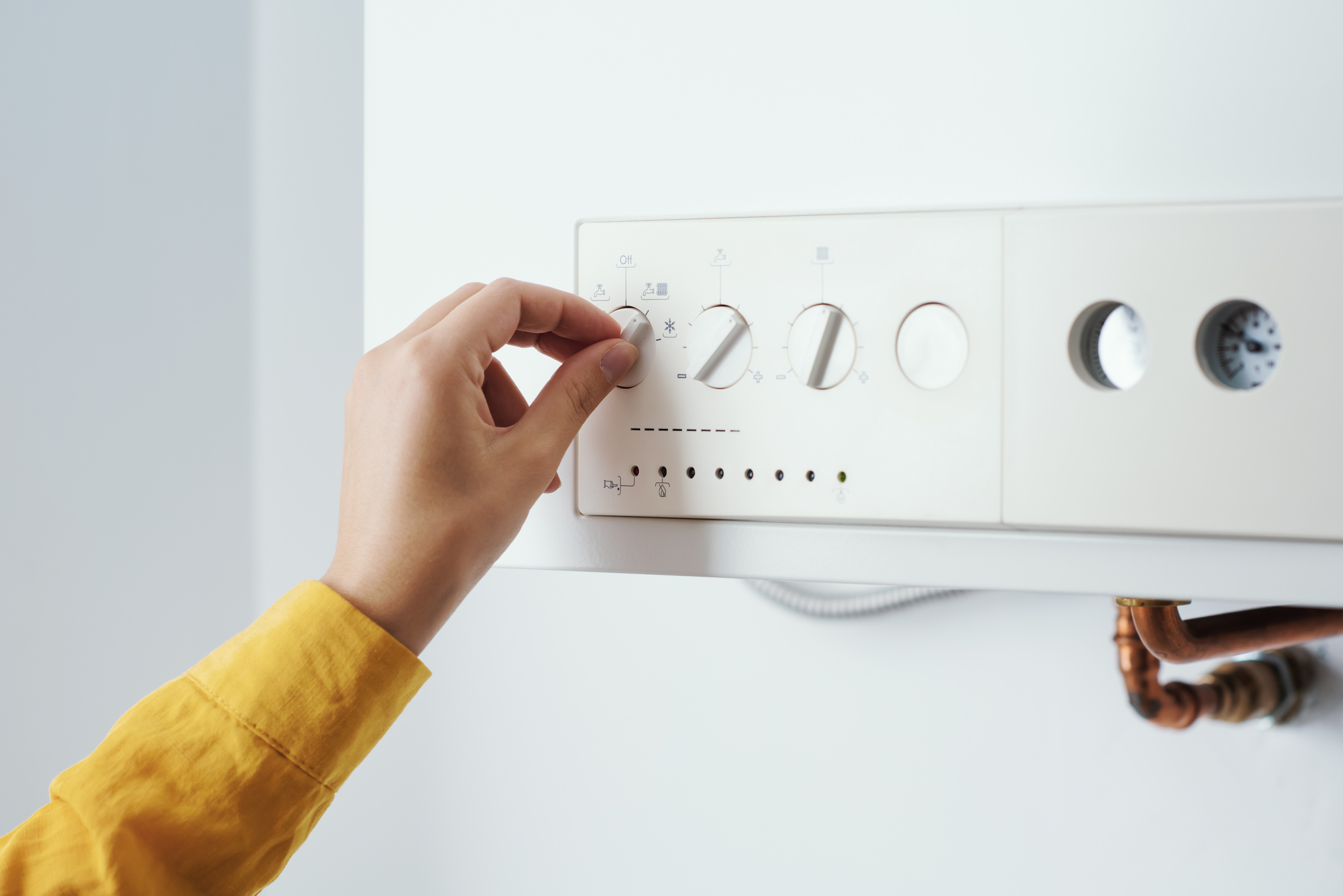 Woman inspecting her boiler