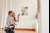 Woman and her child looking at paintings in a gallery
