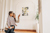 Woman and her child looking at paintings in a gallery