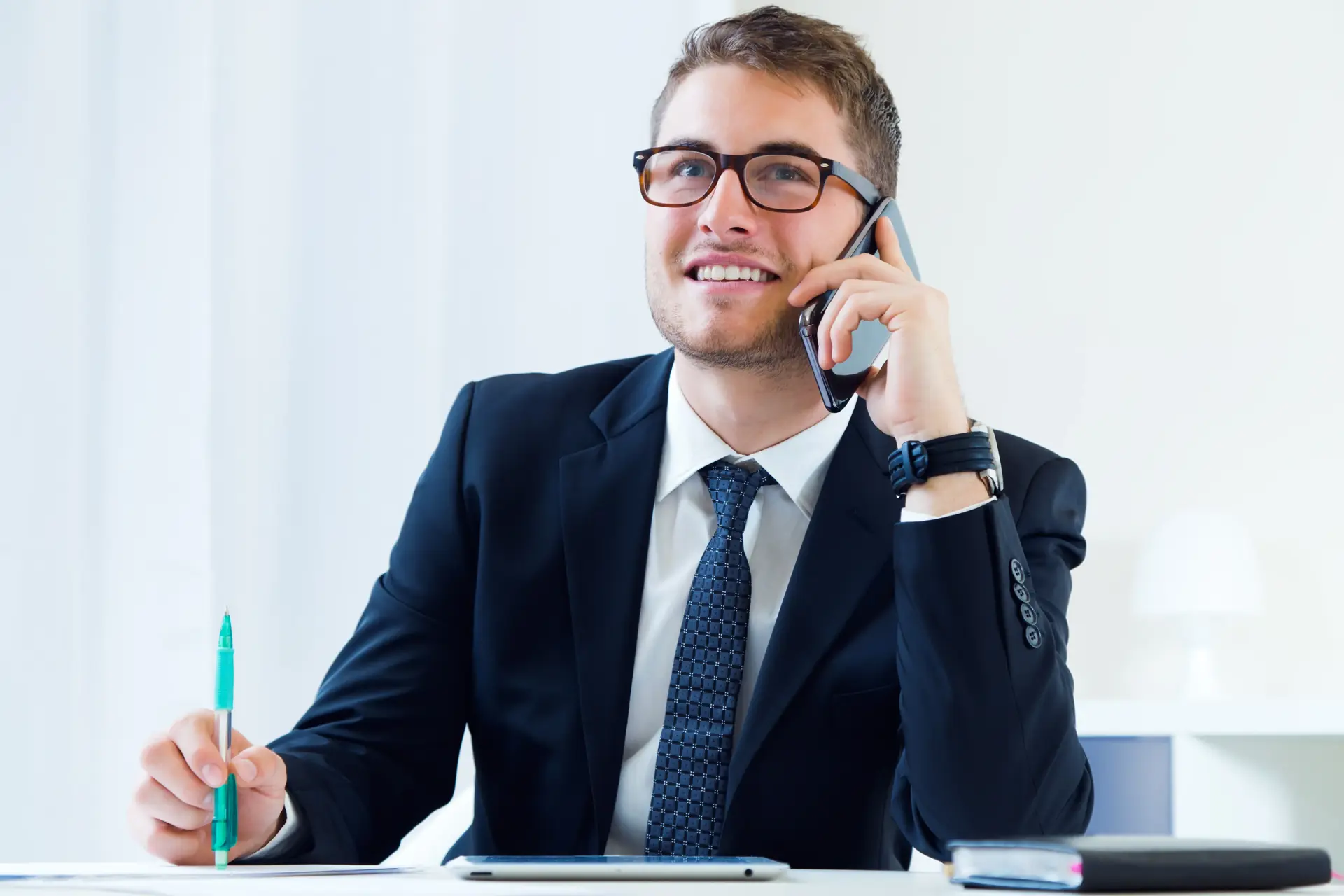 Young Handsome Man Working His Office With Mobile Phone