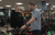 Customer in a cycle shop talking to a bicycle expert about a new bike