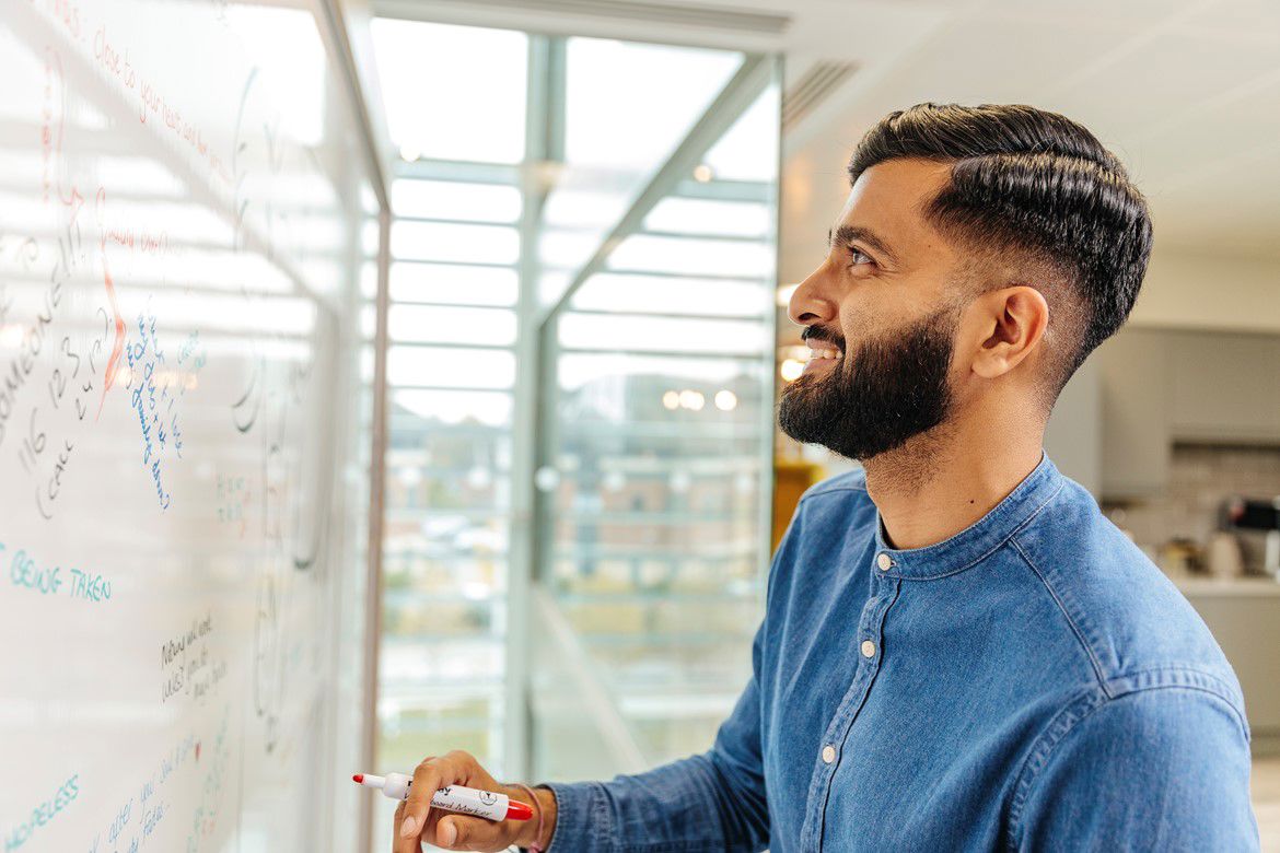 Man reading a white board