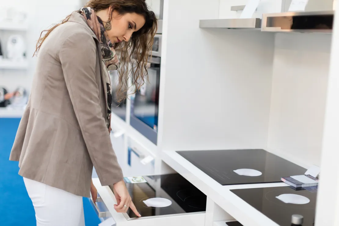 Woman Choosing A New Hob