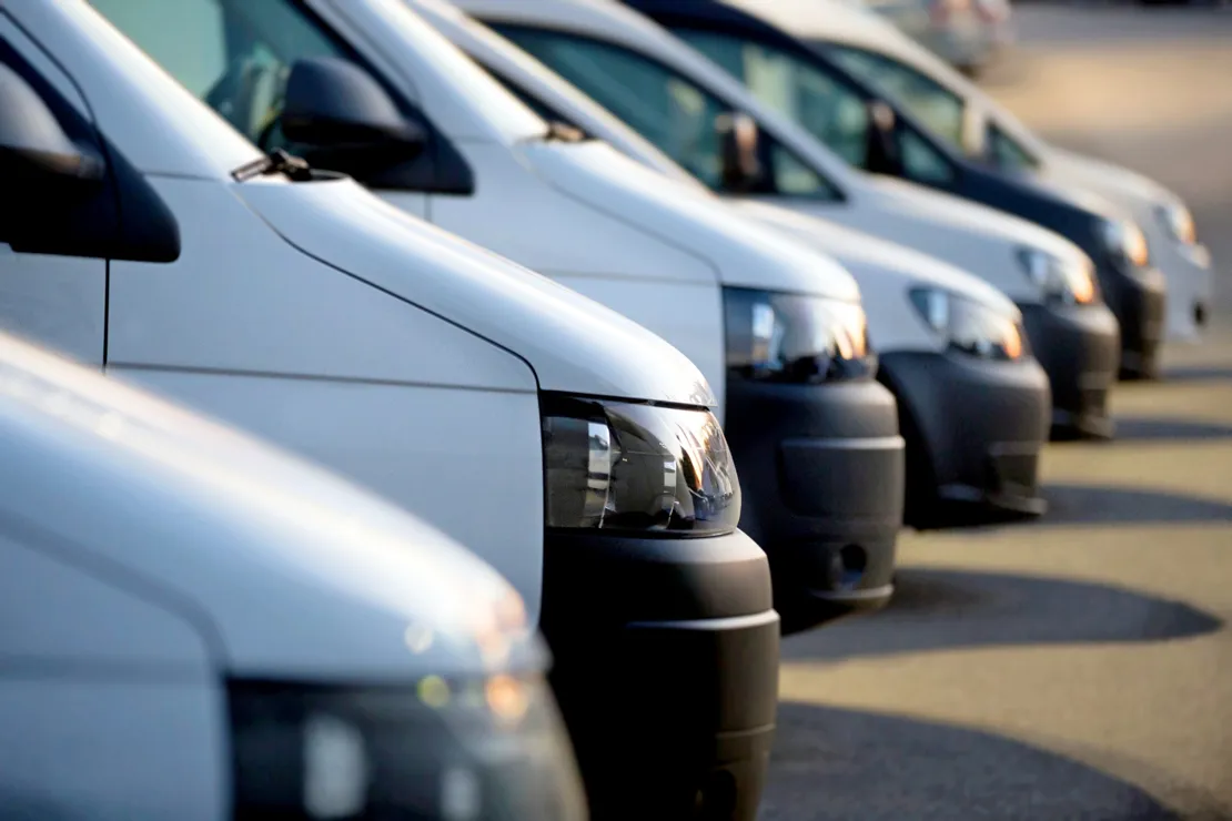 White vans parked in a row