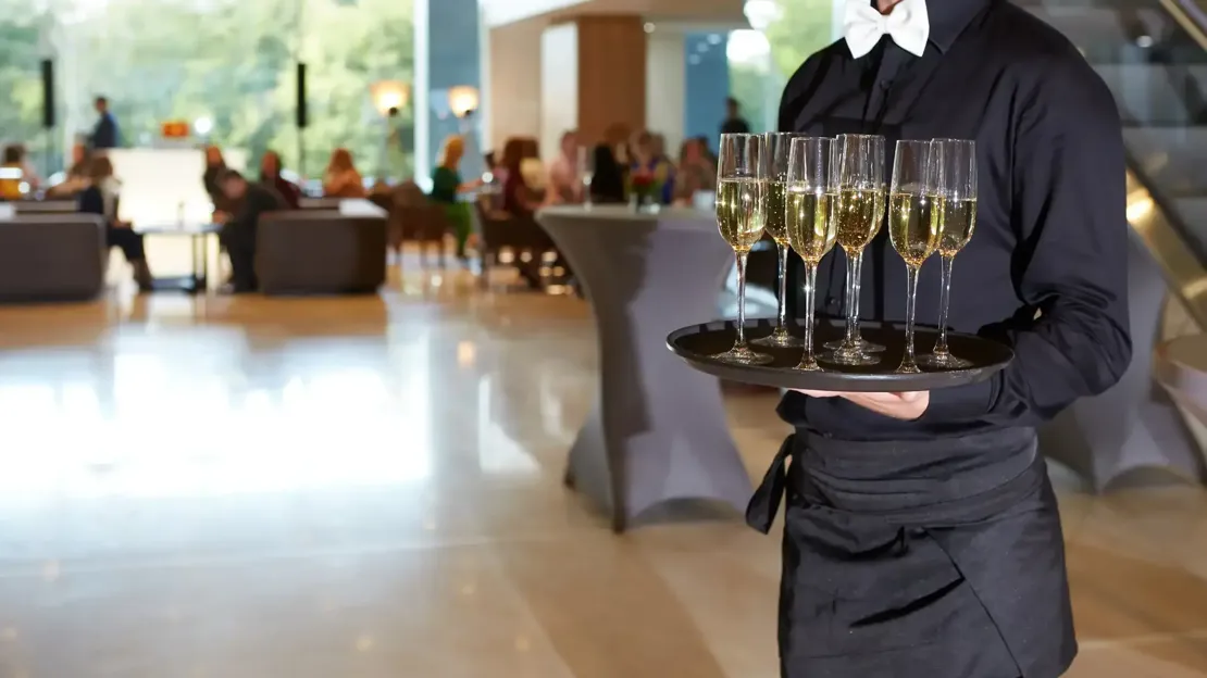 Hospitality Waiter Serving Champagne Tray