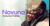 Two people smiling as they window shop on the high street