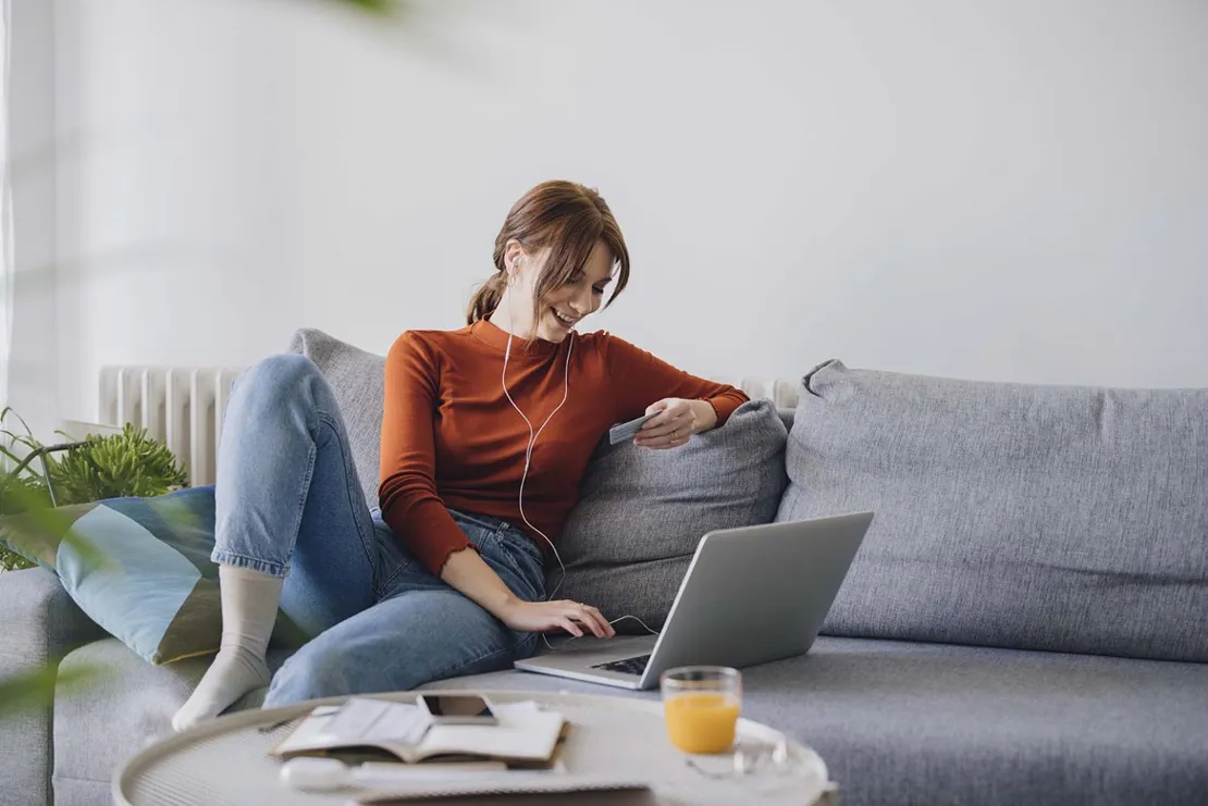 Woman checking cash flow on computer