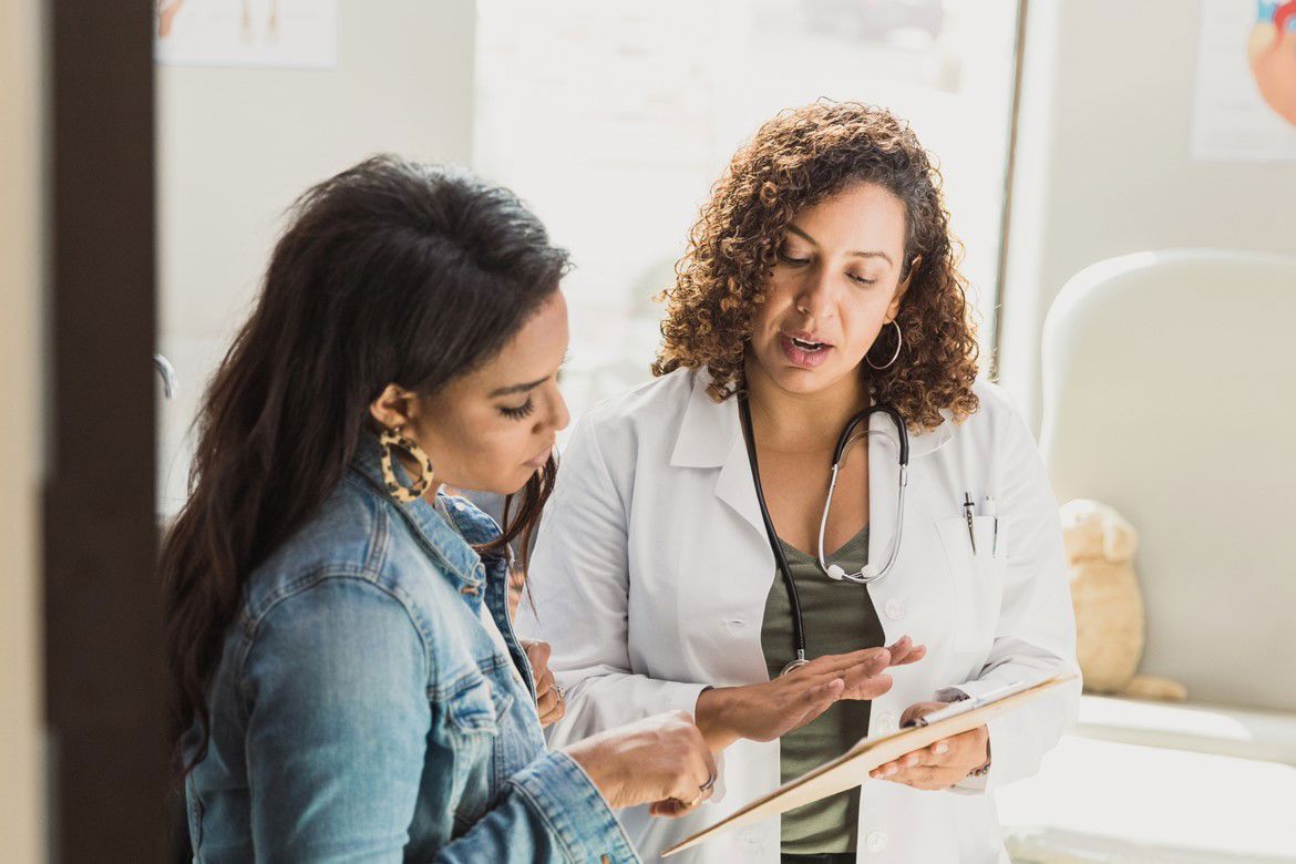 Woman talking to a nurse
