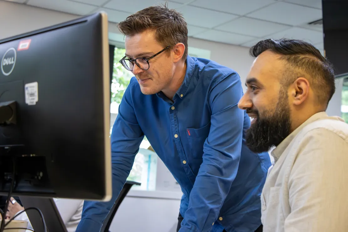 Novuna Team Looking At A Computer