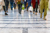 Close up of legs walking through a shopping centre