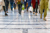 Close up of legs walking through a shopping centre